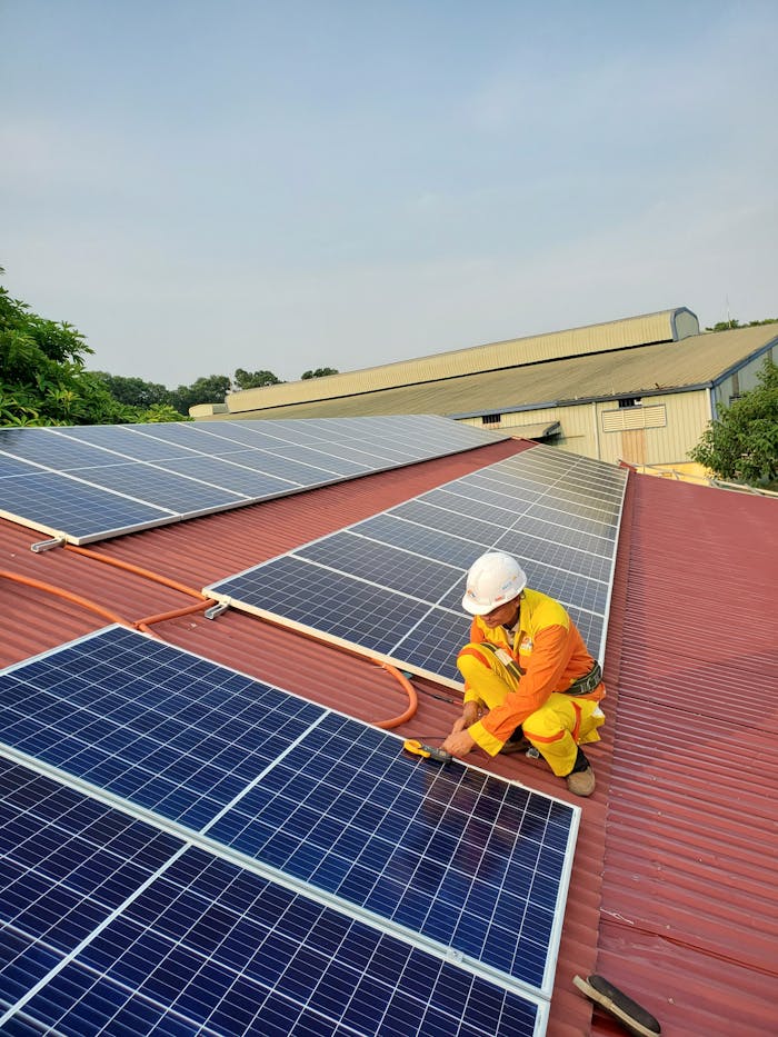 A Man Installing Solar Panels